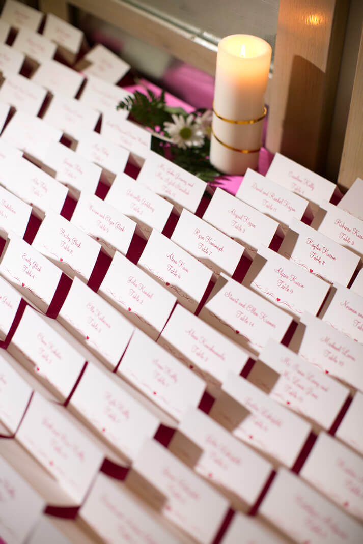 seating cards with pink writing